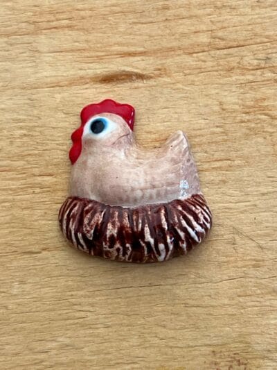 Chicken on nest various colours