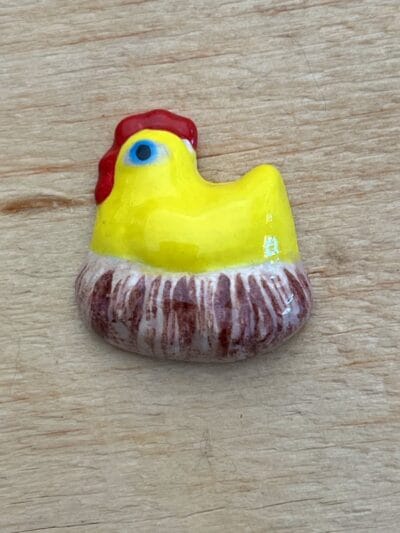 Chicken on nest various colours